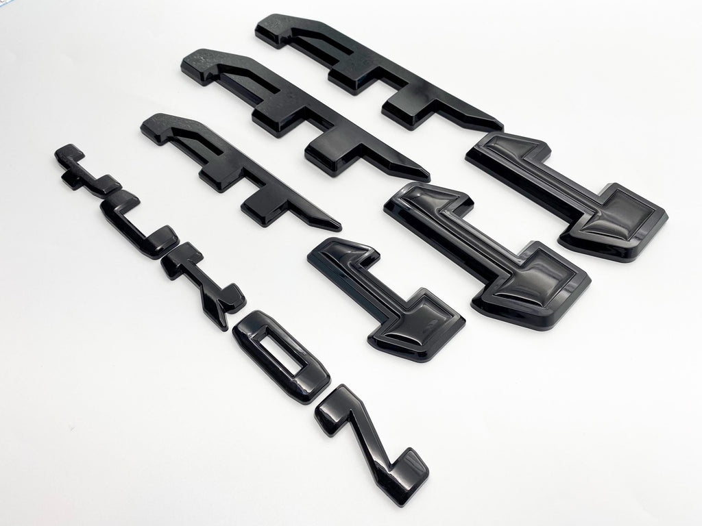 4Pcs Gloss Black Overlay Emblems Kit 2021-2025 Yukon AT4 Letters Emblem 3D Door Rear Nameplate